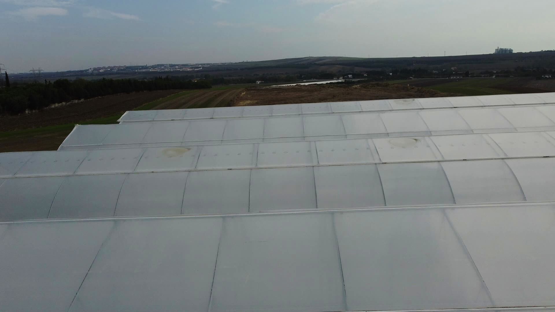 The roof panel grid of the Tibbi Silivri complex from the air — the modular bays an allocation is measured in.